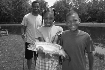Young Haitian Son and Father Fishing