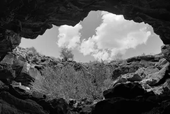 sun shining through a cave opening